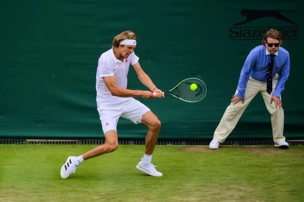 Alexander Zverev of Germany hits a backhand against Taylor Fritz of the United States in the third round of the gentlemen's singles during Day Six of...