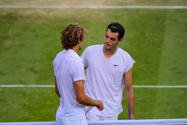 Alexander Zverev of Germany shakes hands with Taylor Fritz of the United States after beating him in the third round of the gentlemen's singles...