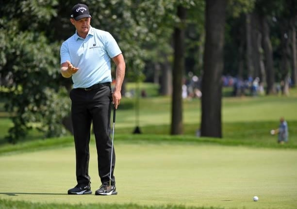 Tom Lewis of England reacts to his putt on the fifth hole during the third round of the Rocket Mortgage Classic on July 03, 2021 at the Detroit Golf...