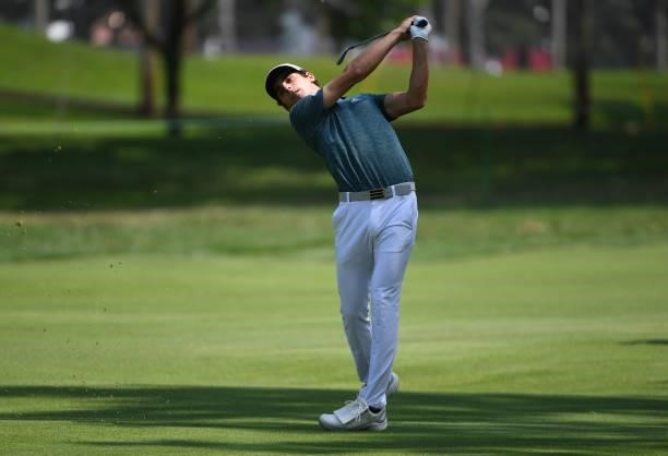 Joaquin Niemann of Chile plays from another fairway as he goes for the seventh green during the third round of the Rocket Mortgage Classic on July...