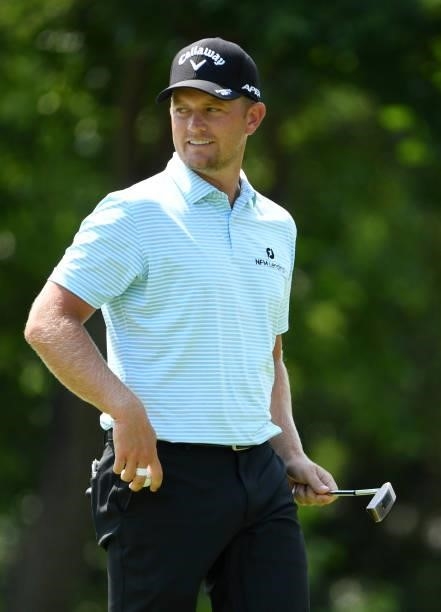 Tom Lewis of England reacts to his putt on the seventh green during the third round of the Rocket Mortgage Classic on July 03, 2021 at the Detroit...