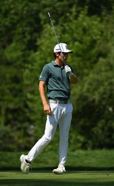 Joaquin Niemann of Chile reacts to his tee shot on the ninth tee during the third round of the Rocket Mortgage Classic on July 03, 2021 at the...