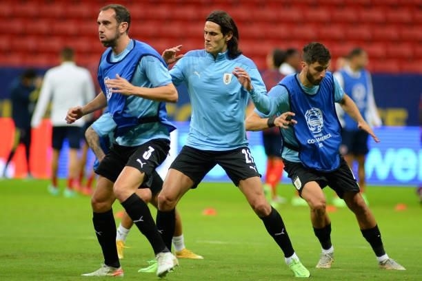 Diego Godin of Uruguay and teammate Edinson Cavani warm up prior to a quarter-final match of Copa America Brazil 2021 between Colombia and Uruguay at...