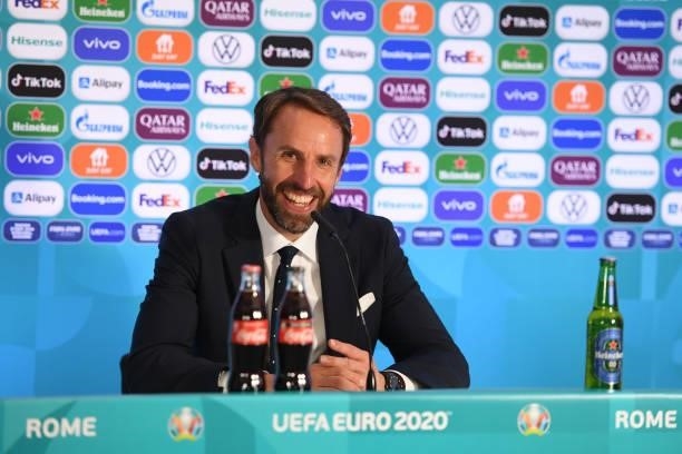 In this handout picture provided by UEFA, Gareth Southgate, Head Coach of England reacts as he speaks to the media during the England Press...