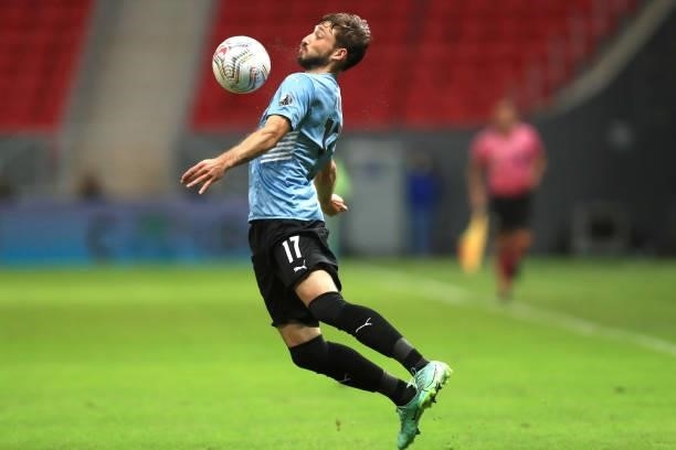 Matias Viña of Uruguay chests the ball during a quarter-final match of Copa America Brazil 2021 between Colombia and Uruguay at Mane Garrincha...