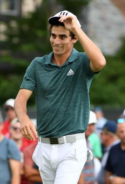 Joaquin Niemann of Chile reacts after making a putt on the 18th green during the third round of the Rocket Mortgage Classic on July 03, 2021 at the...