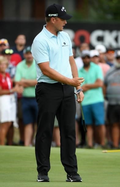 Tom Lewis of England reacts to his putt on the 18th hole during the third round of the Rocket Mortgage Classic on July 03, 2021 at the Detroit Golf...