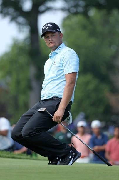 Tom Lewis of England reacts to his putt on the 15th green during the third round of the Rocket Mortgage Classic on July 03, 2021 at the Detroit Golf...