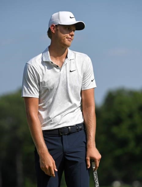 Cam Davis of Australia reacts to missing a putt on the 17th green during the third round of the Rocket Mortgage Classic on July 03, 2021 at the...