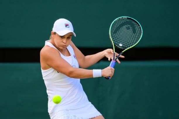 Ashleigh Barty of Australia hits a backhand against Katerina Siniakova of the Czech Republic in the third round of the ladies singles during Day Six...