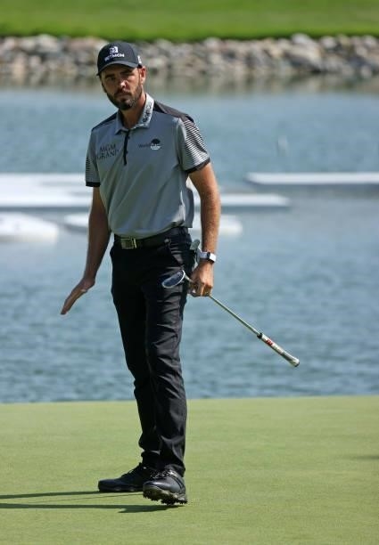 Troy Merritt reacts to his putt on the 14th green during the third round of the Rocket Mortgage Classic on July 03, 2021 at the Detroit Golf Club in...