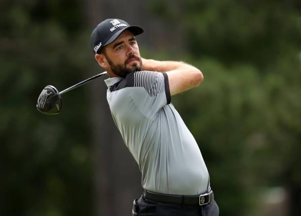 Troy Merritt plays his shot from the fourth tee during the third round of the Rocket Mortgage Classic on July 03, 2021 at the Detroit Golf Club in...