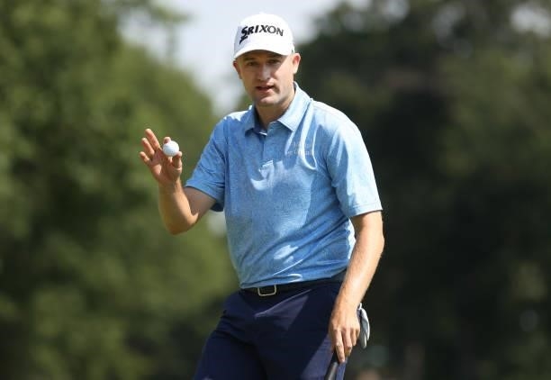 Russell Knox of Scotland reacts to his putt on the 13th green during the third round of the Rocket Mortgage Classic on July 03, 2021 at the Detroit...