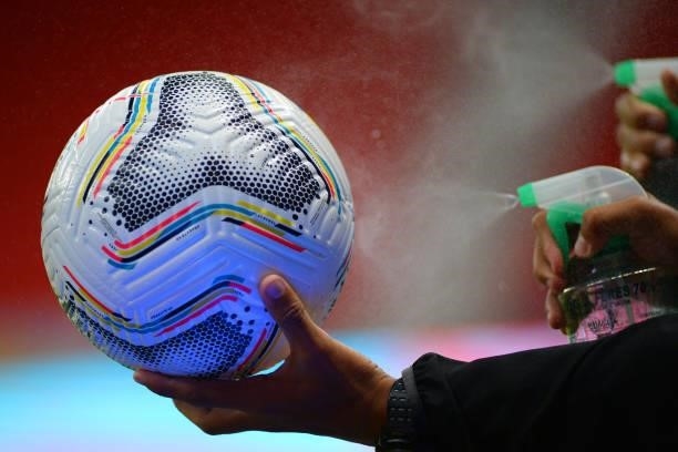 Detail of the match ball as members of the staff spray disinfectant during a quarter-final match of Copa America Brazil 2021 between Colombia and...