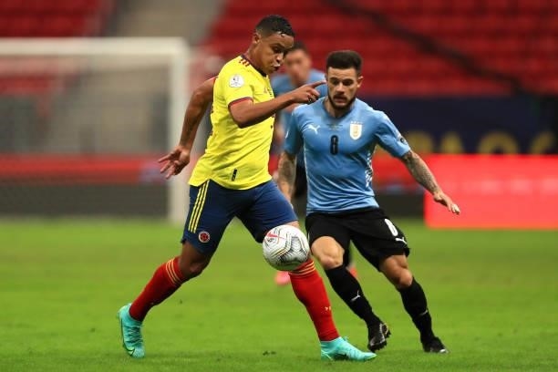Luis Muriel of Colombia fights for the ball with Nahitan Nandez of Uruguay during a quarter-final match of Copa America Brazil 2021 between Colombia...