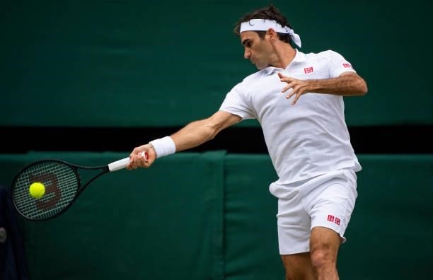Roger Federer of Switzerland hits a forehand against Cameron Norrie of Great Britain in the third round of the gentlemen's singles during Day Six of...