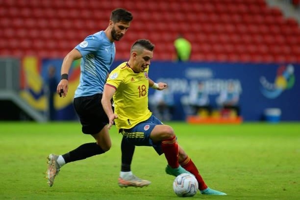 Rodrigo Bentancur of Uruguay fights for the ball with Rafael Santos Borre of Colombia during a quarter-final match of Copa America Brazil 2021...