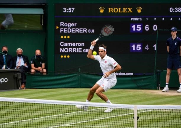 Roger Federer of Switzerland hits a forehand against Cameron Norrie of Great Britain in the third round of the gentlemen's singles during Day Six of...