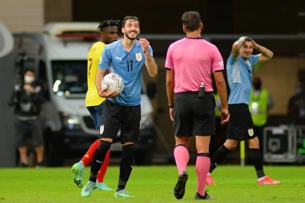 Matias Viña of Uruguay reacts to Spanish referee Jesus Gil Manzano during a quarter-final match of Copa America Brazil 2021 between Colombia and...