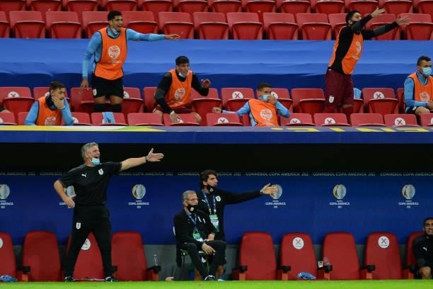 Head coach of Uruguay Oscar Tabarez looks on as his assistants and players react from the stands during a quarter-final match of Copa America Brazil...
