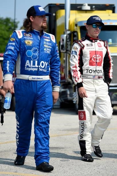 Josh Williams, driver of the Alloy Employer Services Chevrolet, and Brandon Jones, driver of the Toyota Toyota, walk the grid during the NASCAR...
