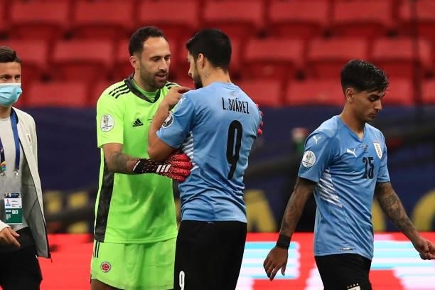 David Ospina of Colombia talks to Luis Suarez of Uruguay after a penalty shootout after a quarter-final match of Copa America Brazil 2021 between...