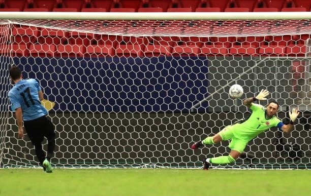 Matias Viña of Uruguay misses his penalty kick as David Ospina of Colombia dives to make a save during a quarter-final match of Copa America Brazil...
