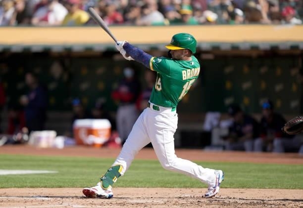 Seth Brown of the Oakland Athletics hits an RBI triple that scored Sean Murphy against the Boston Red Sox in the bottom of the second inning at...