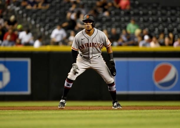 Thairo Estrada of the San Francisco Giants gets a lead from second base against the Arizona Diamondbacks at Chase Field on July 02, 2021 in Phoenix,...