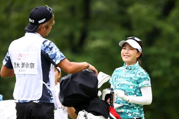 Serena Aoki of Japan talks with her caddie on the 2nd tee during the final round of the Shiseido Ladies Open at Totsuka Country Club on July 4, 2021...
