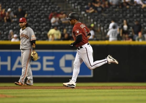 Eduardo Escobar of the Arizona Diamondbacks rounds the bases after hitting a home run against the San Francisco Giants at Chase Field on July 02,...