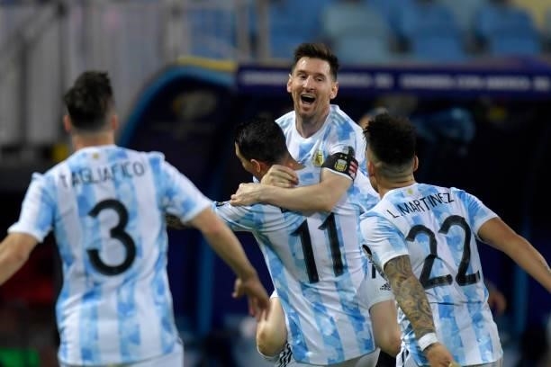 Lionel Messi of Argentina celebrates with teammates after scoring the third goal of his team via free kick during a quarter-final match of Copa...