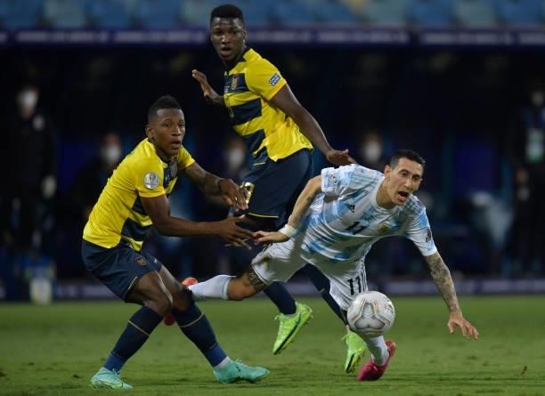 Angel Di Maria of Argentina falls down as he fights for the ball against Pervis Estupiñan of Ecuador during a quarter-final match of Copa America...