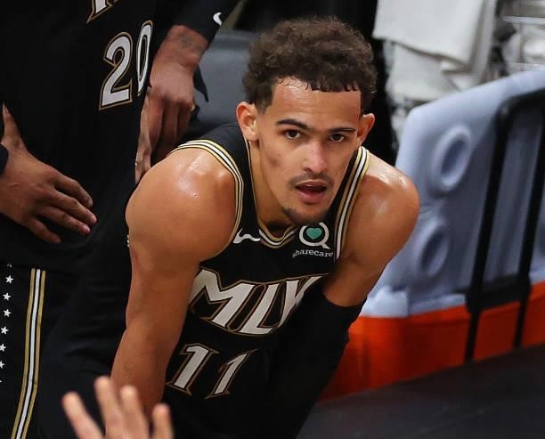 Trae Young of the Atlanta Hawks look on in the final seconds of the team's series loss to the Milwaukee Bucks in Game Six of the Eastern Conference...