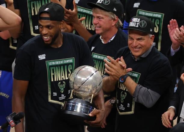 Khris Middleton of the Milwaukee Bucks holds the Eastern Conference Championship trophy after defeating the Atlanta Hawks in Game Six of the Eastern...