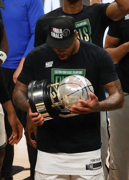 Tucker of the Milwaukee Bucks holds the Eastern Conference Championship trophy after defeating the Atlanta Hawks in Game Six of the Eastern...