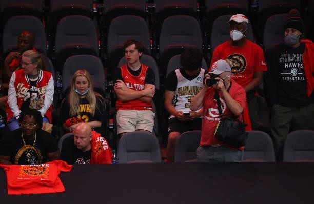 Dejected Atlanta Hawks fans look on after the team's series loss to the Milwaukee Bucks in Game Six of the Eastern Conference Finals at State Farm...