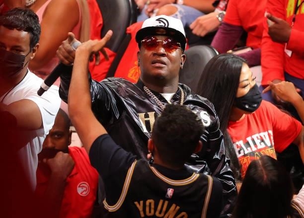 Rapper Yung Joc performs during a time out during the second half in Game Six of the Eastern Conference Finals between the Milwaukee Bucks and the...