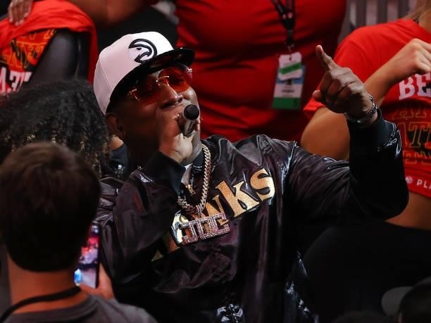 Rapper Yung Joc performs during a time out during the second half in Game Six of the Eastern Conference Finals between the Milwaukee Bucks and the...