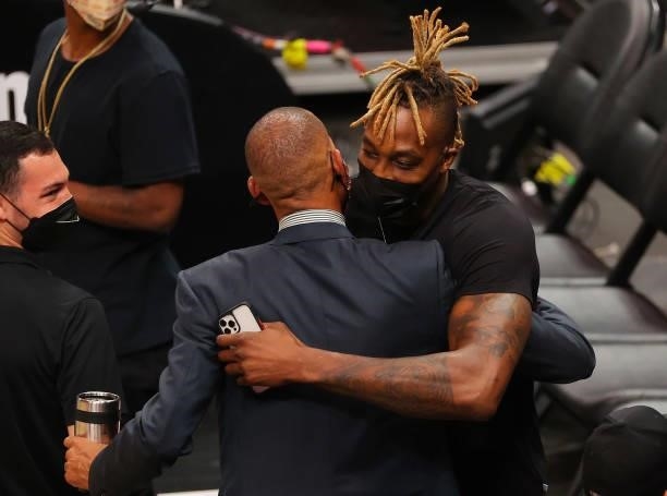 Dwight Howard of the Philadelphia 76ers hugs former NBA great Reggie Miller during the second half in Game Six of the Eastern Conference Finals...