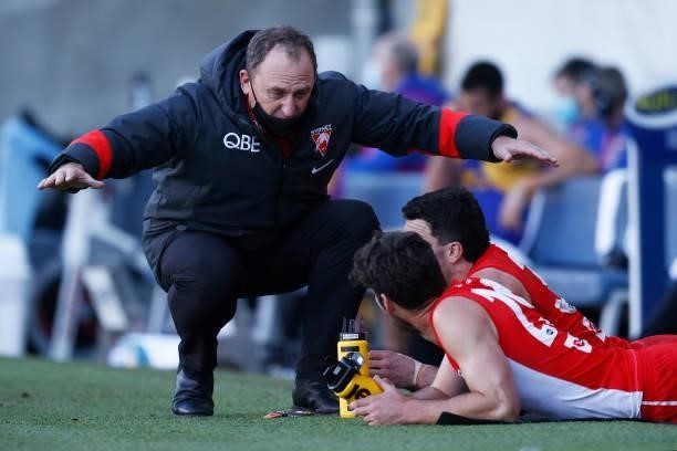 Swans head coach John Longmire speaks to his players on the boundary line during the round 16 AFL match between Sydney Swans and West Coast Eagles at...