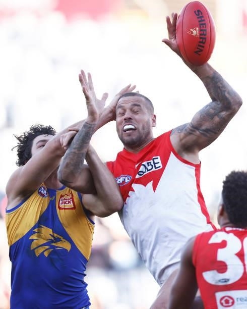 Lance Franklin of the Swans and Tom Barrass of the Eagles contest the ball during the round 16 AFL match between Sydney Swans and West Coast Eagles...