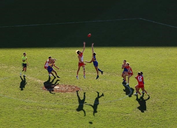Tom Hickey of the Swans and Tim Kelly of the Eagles compete for the ball during the round 16 AFL match between Sydney Swans and West Coast Eagles at...