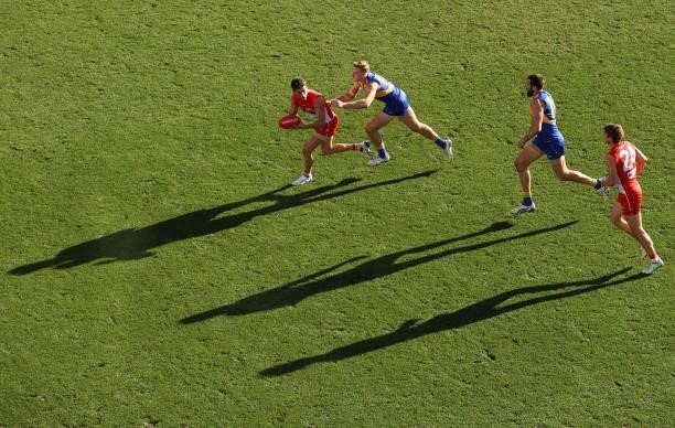 Robbie Fox of the Swans runs with the ball during the round 16 AFL match between Sydney Swans and West Coast Eagles at GMHBA Stadium on July 04, 2021...