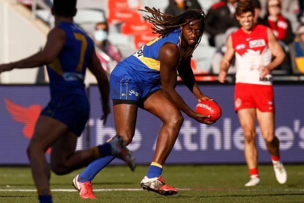 Nic Naitanui of the Eagles runs with the ball during the round 16 AFL match between Sydney Swans and West Coast Eagles at GMHBA Stadium on July 04,...
