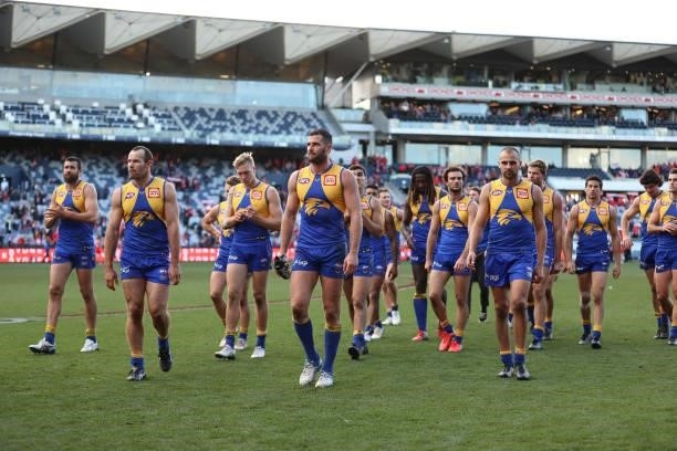 The Eagles walk off the ground after they were defeated by the Swans during the round 16 AFL match between Sydney Swans and West Coast Eagles at...