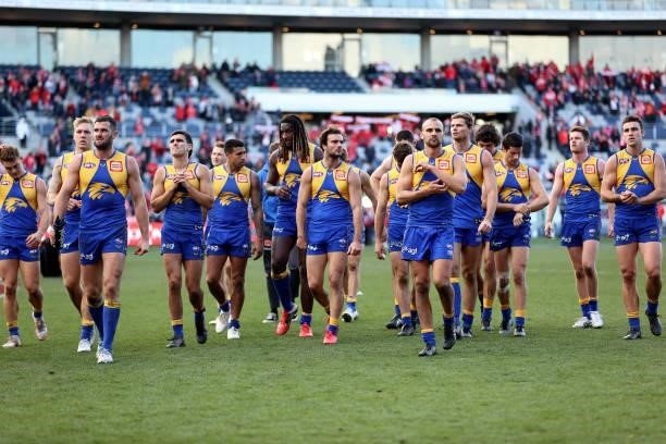 The Eagles walk off the ground after they were defeated by the Swans during the round 16 AFL match between Sydney Swans and West Coast Eagles at...