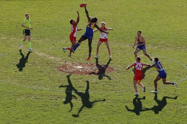 Joel Amartey of the Swans and Nic Naitanui of the Eagles compete for the ball during the round 16 AFL match between Sydney Swans and West Coast...