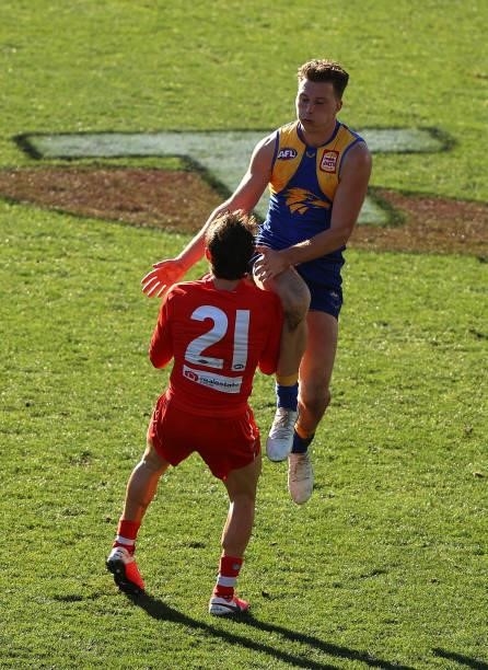 Errol Gulden of the Swans is run into by Alex Witherden of the Eagles during the round 16 AFL match between Sydney Swans and West Coast Eagles at...