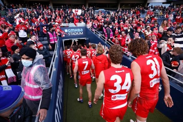 Swans fans celebrate as the players leave the field after winning the round 16 AFL match between Sydney Swans and West Coast Eagles at GMHBA Stadium...